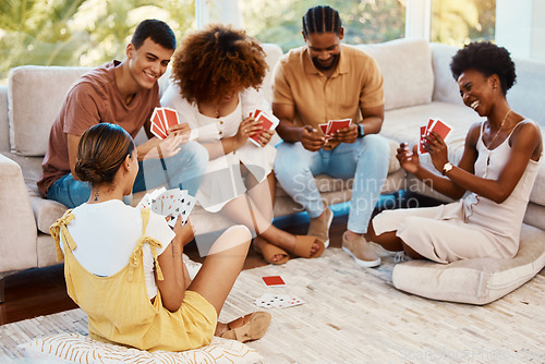 Image of Game, happy or friends playing cards, poker or black jack at home for gambling together in a holiday party. Smile, men or group of women laughing to relax in living room in a fun match competition