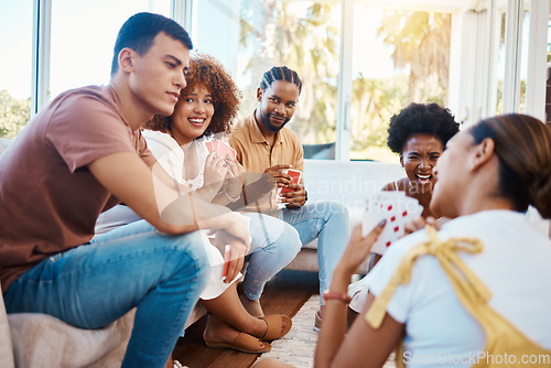 Image of Gambling, happy people or friends playing cards, poker or black jack at home to relax together in a party. Smile, men or group of women laughing in living room in a fun match or game on holiday