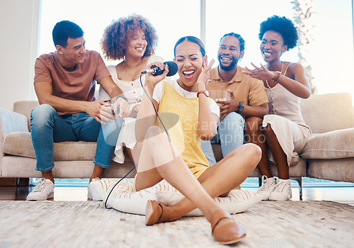 Image of Microphone, happy or friends singing in home living room together in a party on holiday vacation break. Girl singer, men or group of funny women laughing to relax in a fun karaoke competition or game