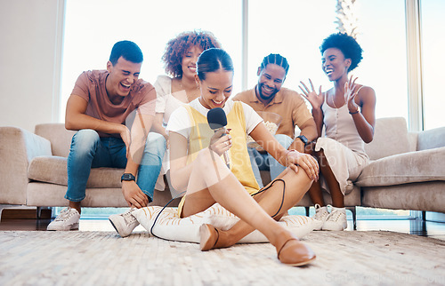 Image of Microphone, laughing or friends singing in home living room together in a party on holiday vacation break. Girl singer, happy men or group of funny women relax in a fun karaoke competition or game