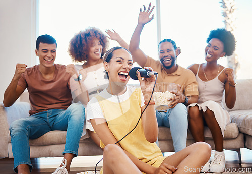 Image of Microphone, happy people or friends singing in home living room together in a party on holiday vacation break. Girl singer, men or group of funny women laughing in a fun karaoke celebration or game