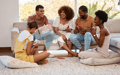 Image of Game, happy people or friends playing cards, poker or black jack at home for gambling together in a party. Smile, men or group of women laughing to relax in living room in a fun match on holiday