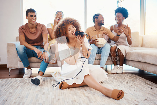 Image of Mic, happy people or woman singer in home living room together in a party on holiday vacation break. Girl singing, excited men or group of funny women laughing in a fun karaoke celebration or game