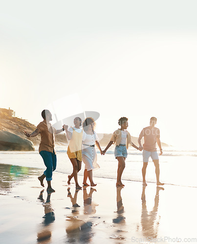 Image of Summer, holding hands and travel with friends at beach for freedom, support and sunset. Wellness, energy and happy with group of people walking by the sea for peace, adventure and vacation mockup