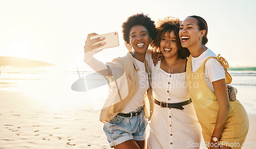 Image of Beach sunset, selfie and group of friends happy, smile and enjoy travel vacation, summer or post photo to social media app. Excited memory picture, photography and gen z women bonding on holiday