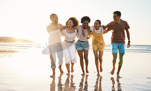 Image of Summer, freedom and travel with friends at beach for relax, support and sunset. Wellness, energy and happy with group of people walking by the sea for peace, adventure and Hawaii vacation together