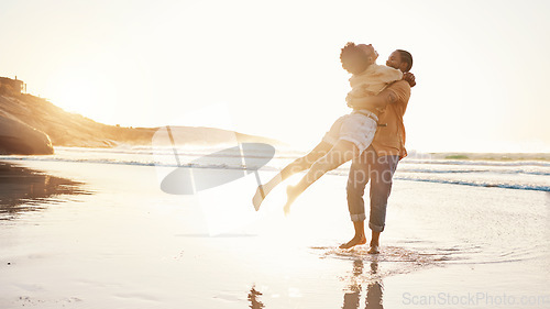 Image of Beach, sunset and happy couple hug, celebrate summer and enjoy romantic time together, bonding and love on travel holiday. Sun flare, sea and excited people embrace on tropical marriage honeymoon