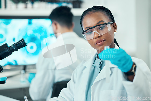 Image of Science, research and black woman with test tube in laboratory, medical engineering and vaccine technology. Biotechnology, pharmaceutical study and medicine, scientist or lab technician with solution