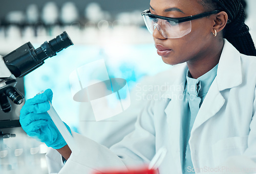 Image of Science, thinking and black woman with test tube in laboratory, medical engineering and vaccine research. Biotechnology, pharmaceutical study and medicine, scientist or lab technician with solution.