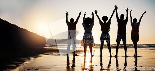 Image of Beach, celebration and back of friends at sunset with arms up for freedom, fun and travel success. Ocean, silhouette and rear view of people celebrating journey, adventure and summer vacation in Bali