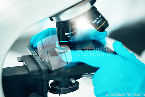 Image of Microscope, medical science and research in a laboratory for analysis, study or development. Zoom on equipment for research, future and gloves of scientist person with virus, particle or dna sample