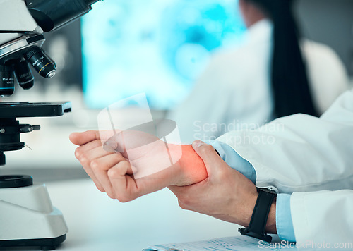 Image of Joint pain, hands or man scientist with wrist injury, bad problem or carpal tunnel in medical laboratory. Broken bone, arm or overworked doctor feeling bruise muscle or fracture in accident closeup