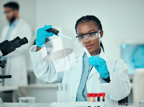 Image of Science, blood and research, black woman with test tube in laboratory and medical engineering solution. Biotechnology, vaccine study and liquid in pipette, scientist or lab technician checking sample