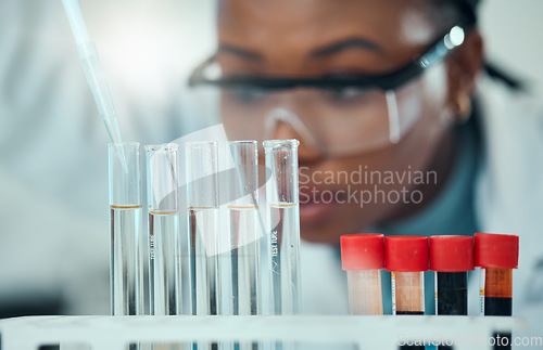 Image of Science, blurred background and blood, woman with test tube in laboratory for research and medical engineering. Biotechnology, pharmaceutical study and pathology, scientist or technician with pipette