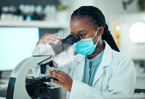 Image of Woman, science and microscope for laboratory research, blood test and dna or virus analysis with face mask. Professional scientist or medical student in biotechnology and check for covid or bacteria