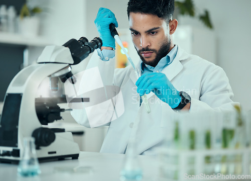 Image of Science, results and man with test tube in laboratory, research and medical engineering at microscope. Biotechnology, pharmaceutical and study, scientist or lab technician checking solution in glass.