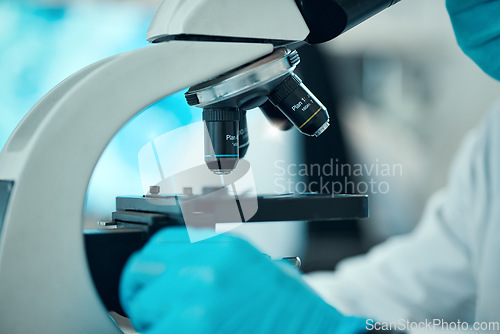 Image of Microscope, medical science and a scientist in a laboratory for analysis, study or development. Zoom on equipment for research, future and gloves of a person with a sample for virus, particle or dna