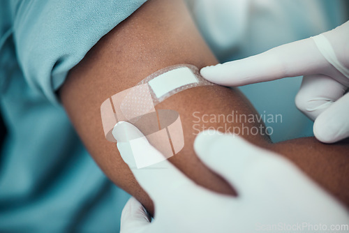 Image of Plaster, vaccine and hands of nurse with patient with bandage for flu shot, injection and immunity. Healthcare, hospital and closeup of arm of person for medicine, vaccination and virus protection