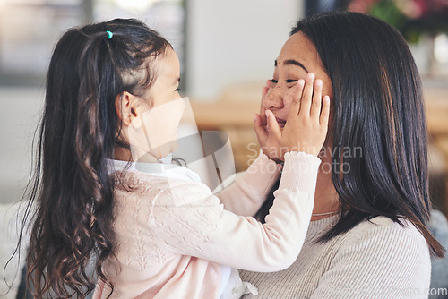 Image of Smile, happy and playful with mother and daughter on sofa for love, care and support. Funny, calm and relax with woman and young girl embrace in living room of family home for peace, cute and bonding