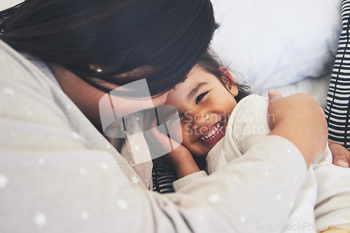 Image of Bed, mother and daughter hug at home with love, care and happiness in morning. Portrait of a woman and girl child together in a bedroom for fun time, playing and security or relax in a family house