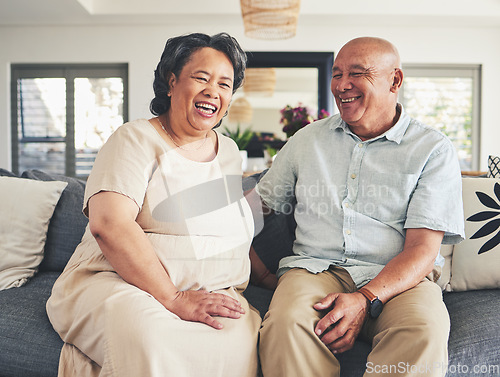 Image of Home, happy and senior couple on a couch, love and romance with retirement, funny and affection. Romantic, happy old woman and elderly man on a sofa, smile and bonding with care, marriage and support