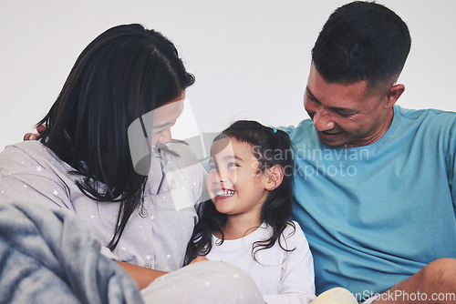 Image of Love, family and child in bed at home with care, support and happiness in morning. A woman, man and girl kid laugh together in a bedroom for fun time, playing and security or relax in a house