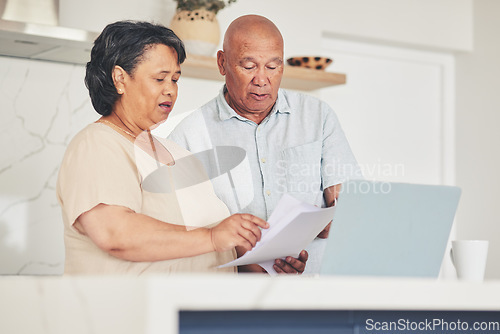 Image of Laptop, documents and finance with old couple in kitchen for budget report, payment and mortgage. Accounting, online banking and savings with senior man and woman for investment, retirement and taxes