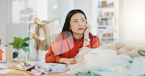 Image of Woman or fashion designer thinking of ideas in manufacturing studio, inspiration or planning clothes production. Asian person contemplating creative or thoughtful strategy in textile, tailor business