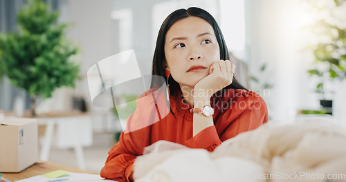 Image of Woman or fashion designer thinking of ideas in manufacturing studio, inspiration or planning clothes production. Asian person contemplating creative or thoughtful strategy in textile, tailor business