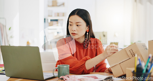 Image of Box, ecommerce and laptop with asian woman writing for order, delivery and online shopping distribution. Seller, package and retail with small business owner for parcel, shipping and labelling