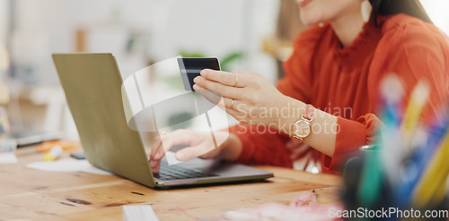 Image of Woman hands, credit card and laptop for business online shopping, trading or fintech payment in office startup. Professional person typing bank information on computer for website loan or transaction