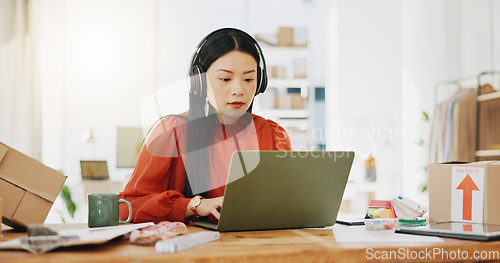 Image of Business, fashion designer and Asian woman with checklist for planning, logistics and order delivery. Retail, commerce and girl listen to music for productivity for clothes, shipping and distribution