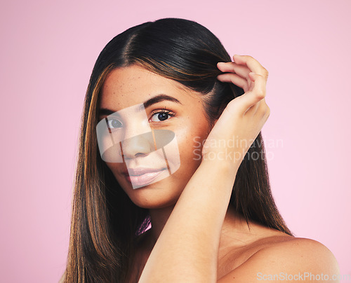 Image of Portrait, hair care and woman with growth, smile and texture on a pink studio background. Face, person or model with skincare, cosmetics and dermatology with self care, salon treatment and luxury