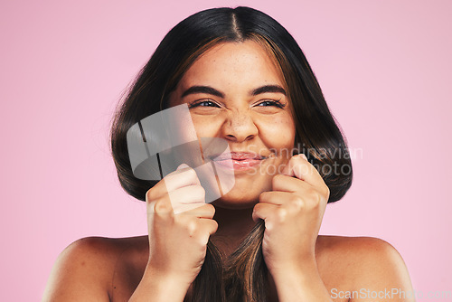 Image of Healthy hair, beauty and woman in studio with mockup for texture, treatment or shine on pink background. Haircare, glow and female model with growth, results and strand strength, keratin or cosmetics