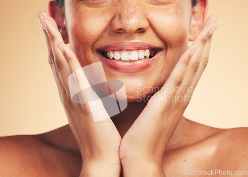 Image of Skincare, smile and hands on woman face in studio for cosmetic, wellness and dermatology on brown background. Happy, beauty and lady model excited for glowing skin, results or self love cosmetology