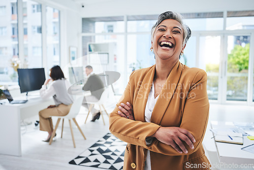 Image of Happy, mature woman and manager with arms crossed in office, workplace and confident in working for professional startup. Portrait, smile and person with pride and happiness in Egypt business