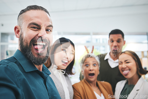 Image of Portrait, selfie and group of funny business people in office for team building, collaboration and support. Diversity, teamwork and happy friends with silly faces for profile picture on social media