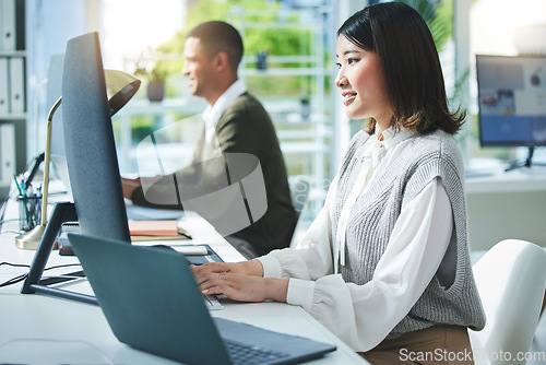 Image of Business woman, computer and office for marketing research, multimedia planning or copywriting. Professional worker, employees or editor typing on desktop for editing online and research in workspace