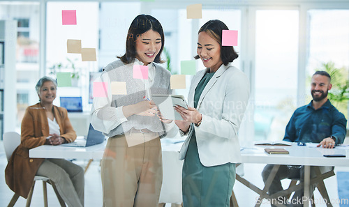 Image of Business women, tablet and teamwork on glass board for marketing, project planning and happy ideas in meeting. Professional people for digital, sticky notes and scrum or agile presentation in office