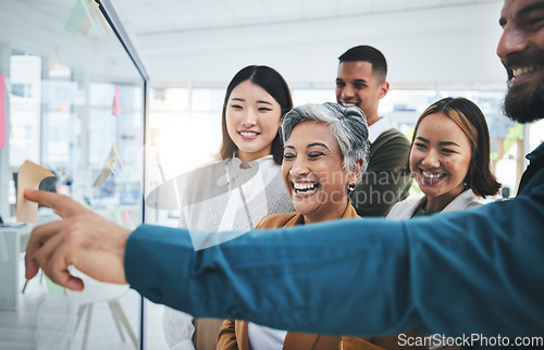 Image of Happy, writing and staff at glass board for creative marketing with sticky notes and pointing. Calendar planning, content creator schedule and management staff laughing in a business meeting teamwork