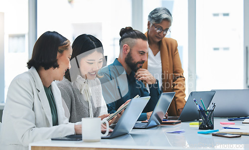 Image of Business people, laptop and meeting, marketing team and creative group at digital agency with research online. Man, women and diversity, working together and senior leader with branding strategy