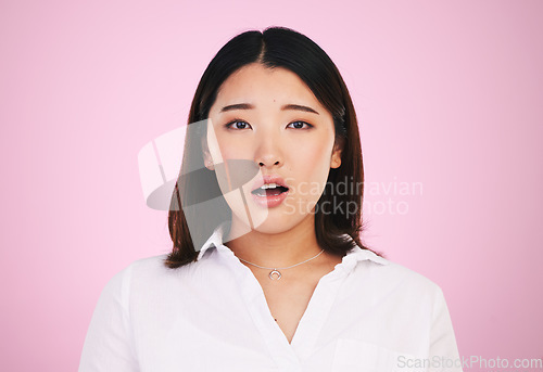 Image of Wow, shock and surprise, portrait of asian woman with confusion for giveaway news or announcement in studio. Gen z girl with surprised face, emoji or meme isolated on pink background with mockup.