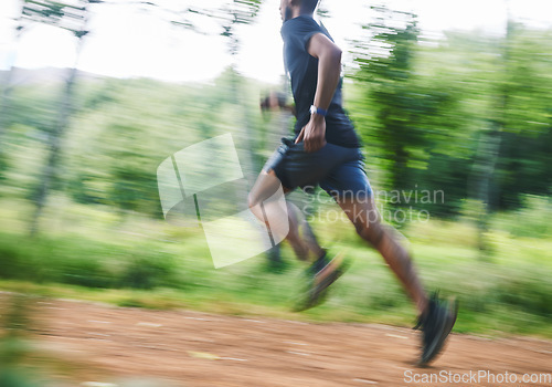 Image of Sports man, speed and running in forest with motion blur, cardio workout and exercise action. Runner, fast athlete and training for marathon challenge with energy, dynamic fitness and power in park