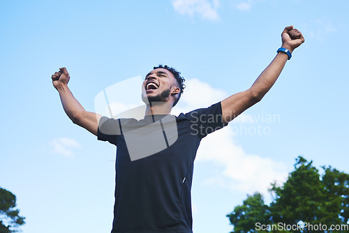 Image of Runner man, fist celebration and nature with goals, achievement and pride for race, success and contest. Young athlete guy, happy winner and outdoor for fitness, competition and freedom in summer