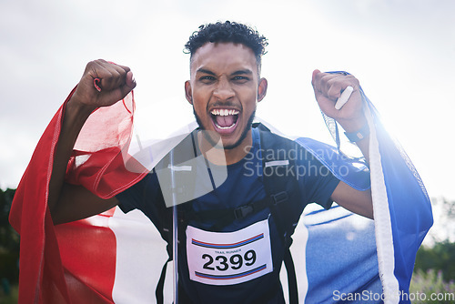 Image of Runner man, celebration portrait and flag for France, pride and excited for fitness, goals and success in nature. Athlete guy, happy winner or champion with cloth, fabric or sign with fist at contest