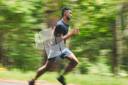 Image of Sports man, action and running in park with speed, cardio workout or power of motion blur. Runner, athlete or training for marathon race with energy, dynamic exercise or fast performance pace outdoor