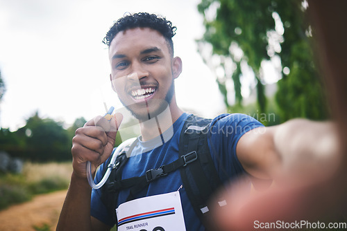 Image of Runner man, athlete and outdoor in selfie, race or excited for triathlon, hiking or adventure in woods. Young African guy, happy and photography for memory, profile picture or post for social network