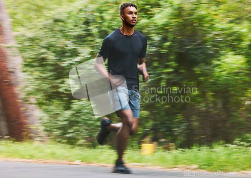 Image of Man running with speed in park for exercise, fitness and power of cardio workout, action and race. Runner, sports athlete and motion blur for marathon training, energy and fast performance outdoor