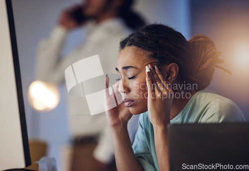 Image of Tired, headache and a business woman in an office at night working late on deadline. African entrepreneur person with hands on head for pain, burnout or depression and mistake or fatigue at work