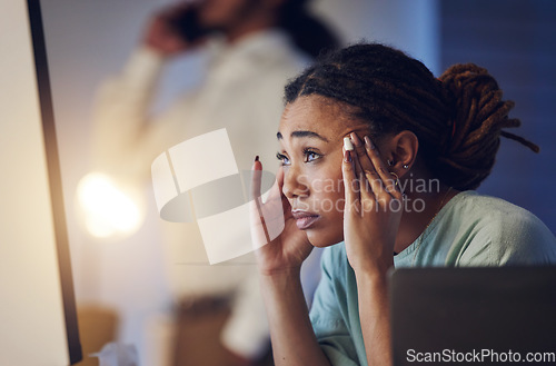 Image of Business woman, anxiety and stress at computer in office at night working late on deadline. Tired African entrepreneur person with hand on head for pain, headache or burnout thinking of work crisis